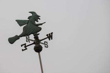 weather vane with a witch 