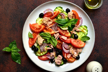 Fresh vegetable salad with tuna. Top view with copy space.