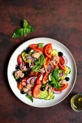 Fresh vegetable salad with tuna. Top view with copy space.