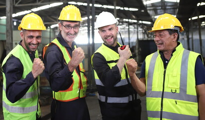 worker or engineer working in factory with safety uniform , safety hat and safety glasses , image is safety concept or happy workplace