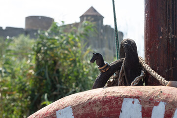 A black chess horse against the background of the Akcreman fortress