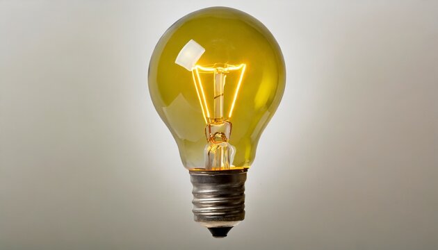 glowing yellow light bulb on white