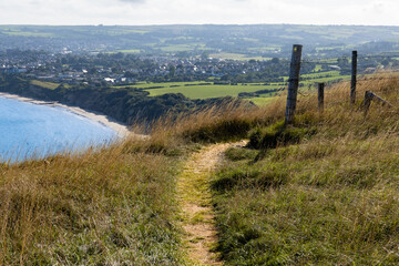 Purbeck Way footpath high up on Ballard Cliffs with Swanage bay view