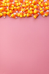 Candy corn on pink background