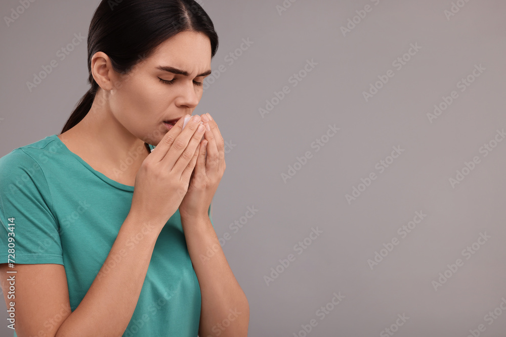 Sticker Woman coughing on grey background, space for text. Cold symptoms