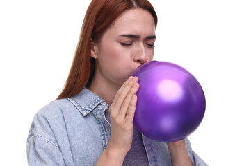 Woman inflating purple balloon on white background