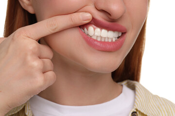 Obraz premium Woman showing her clean teeth on white background, closeup