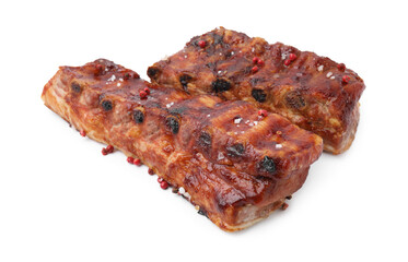 Tasty roasted pork ribs and peppercorns isolated on white