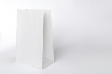 One paper bag on white background, space for text