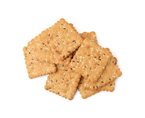 Pile of cereal crackers with flax and sesame seeds isolated on white, top view