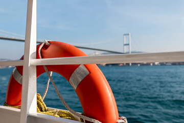 Orange lifebelt on the ship. Security concept for the boat passengers