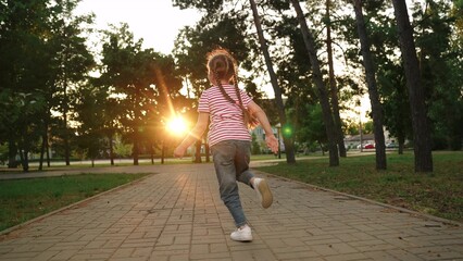 little girl running through park sunset, happy family, running foot along road kid girl daughter, tournament, strong willed hardy, strengthens immune system, fun happiness, sports training, women