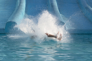 Person Swimming in Pool Near Water Slide