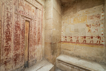 Interior of an ornately decorated tomb in Saqqara, Egypt