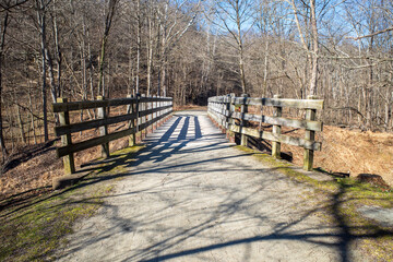 A bridge with leading lines to the footpath on the Youghiogheny River Trail at Cedar Creek Park, Westmoreland County, Pennsylvania.