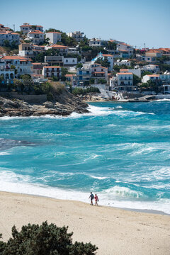 People walking on the beach of Armenistis in Ikaria