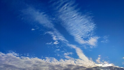 Beautiful white textured clouds in a blue sky.