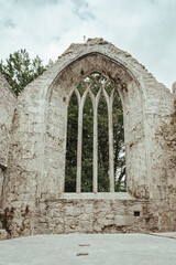 Fototapeta na wymiar Window of an old abandoned abbey