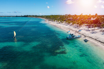 Tropical coastline with resorts, palm trees and caribbean sea. Dominican Republic. Aerial view - obrazy, fototapety, plakaty