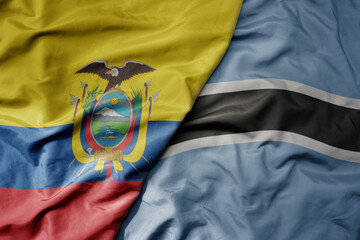 big waving national colorful flag of botswana and national flag of ecuador .