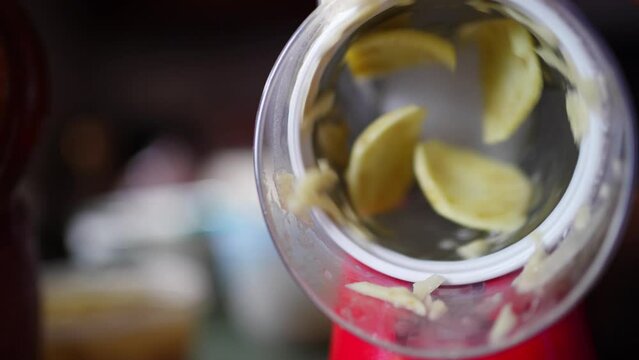 grating or slicing potato chips with Round Mandoline Drum Slicer Rotary grater chopper, preparing vegetarian food close up