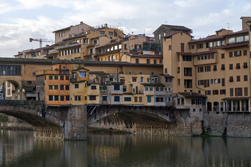 Fototapeta na wymiar Scenic view of the Ponte Vecchio medieval stone bridge in Florence, Italy.