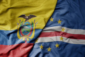 big waving national colorful flag of cape verde and national flag of ecuador .