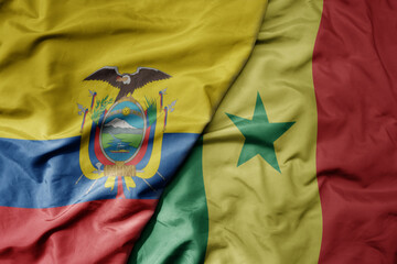 big waving national colorful flag of senegal and national flag of ecuador .