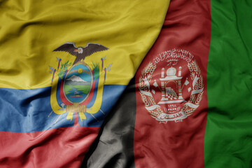 big waving national colorful flag of afghanistan and national flag of ecuador .