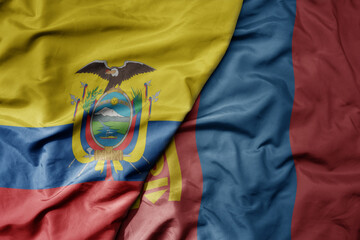 big waving national colorful flag of mongolia and national flag of ecuador .