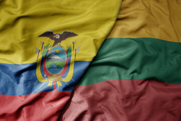 big waving national colorful flag of lithuania and national flag of ecuador .