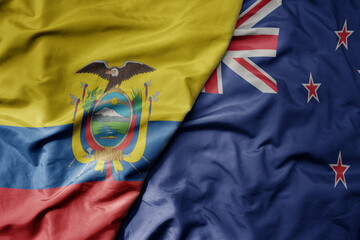 big waving national colorful flag of new zealand and national flag of ecuador .