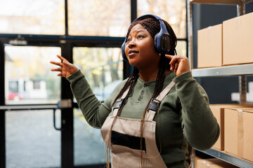 Manager wearing headset and having fun during work break, enjoying free time before start working...