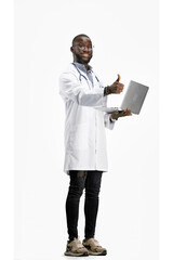 The doctor, in full height, on a white background, uses a laptop