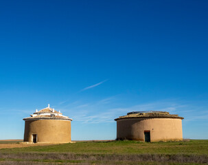 Two cylindrical dovecotes in Villafrades de Campos. Valladolid, Castile and Leon, Spain.