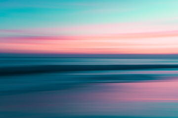 Sunrise over the ocean, abstract colorful scene in bright blue and pink colors