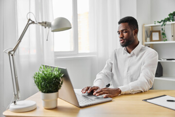 man laptop african freelancer office education computer indoor job american student online