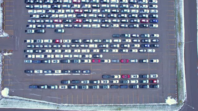 Aerial view of car storage or parking lot with new and used vehicles for export to USA and Internationally. Vehicle transportation facility, waiting to pass customs, duties licenses and permits.