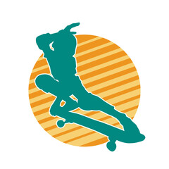 Silhouette of a male in action pose on skateboard. Silhouette of an urban boy on skateboard.
