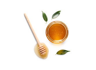Tasty honey in glass jar, leaves and dipper on white background, flat lay. Space for text
