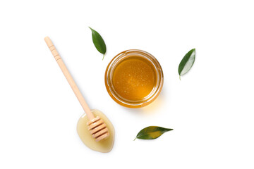 Tasty honey in glass jar, leaves and dipper on white background, flat lay