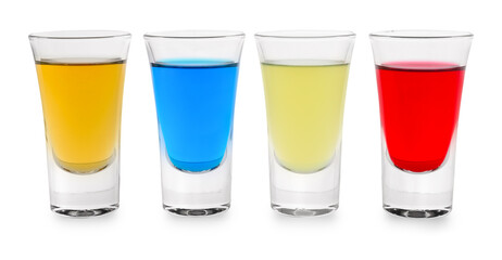 Different shooters in shot glasses isolated on white. Alcohol drink