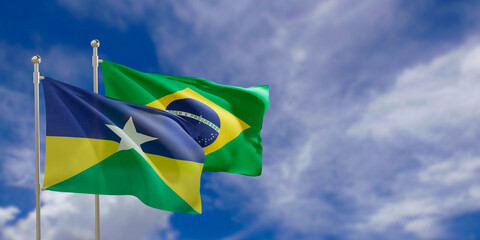 Official flags of the country Brazil and federal state of Rondonia. Swaying in the wind under the blue sky. 3d rendering
