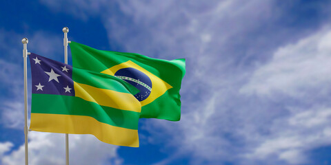 Official flags of the country Brazil and federal state of Sergipe. Swaying in the wind under the blue sky. 3d rendering - obrazy, fototapety, plakaty