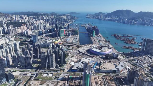 Seaside Commercial residential construction site in Kai Tak Cruise Terminal Hong Kong city, Kwun Tong, and Kowloon Bay near Victoria harbor, Aerial drone Skyview