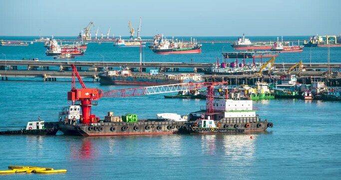 Logistic shipping quay boat Engineering crane depot at logistic export terminal control. Warehouse freight background container yard loading quayside harbor port. Logistics seascape shipping portal