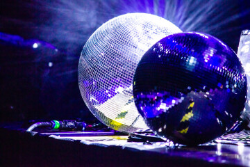 reflective ball on stage, protective helmet in the background