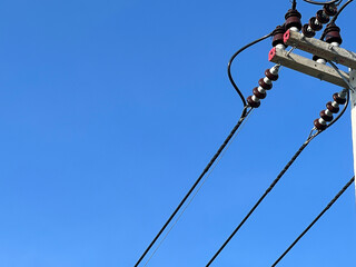 a power pole with a bunch of wires