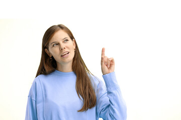 Woman, close-up, on a white background, pointing up