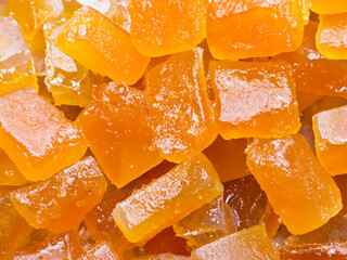 a pile of orange gummy squares